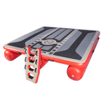 Angled view of the inflatable Hawaii Tritoon platform in grey and red with a black traction surface and ladder attachment.