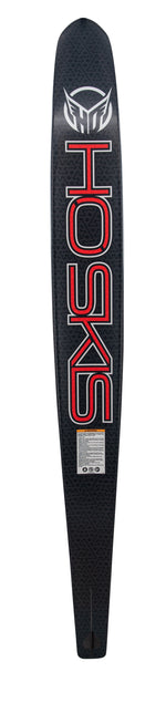 Base view of the Carbon Omni 2022 waterski, showcasing a black carbon fiber pattern with bold red "HO SKIS" lettering.